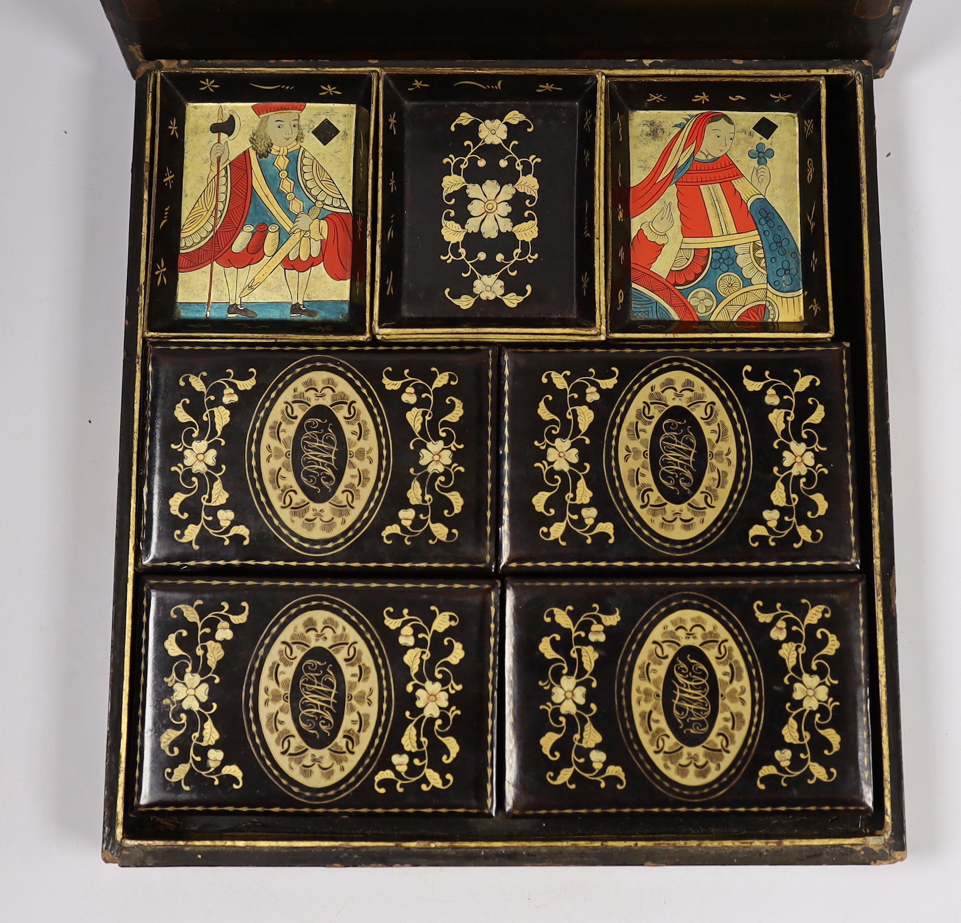 A mid 19th century Chinese export lacquer games box, containing mother of pearl counters